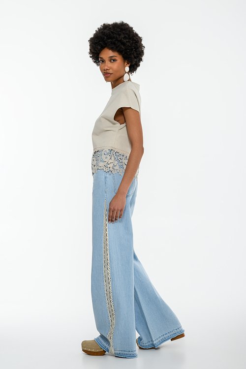 Blouse with embroidered cutwork detail on the hem
