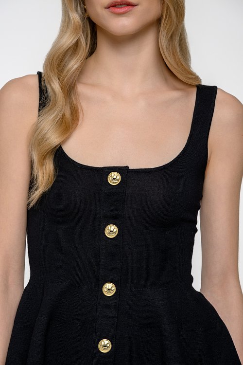 Knit peplum top with golden buttons detail