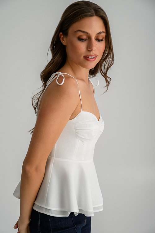 Top with thin straps tie and peplum hem