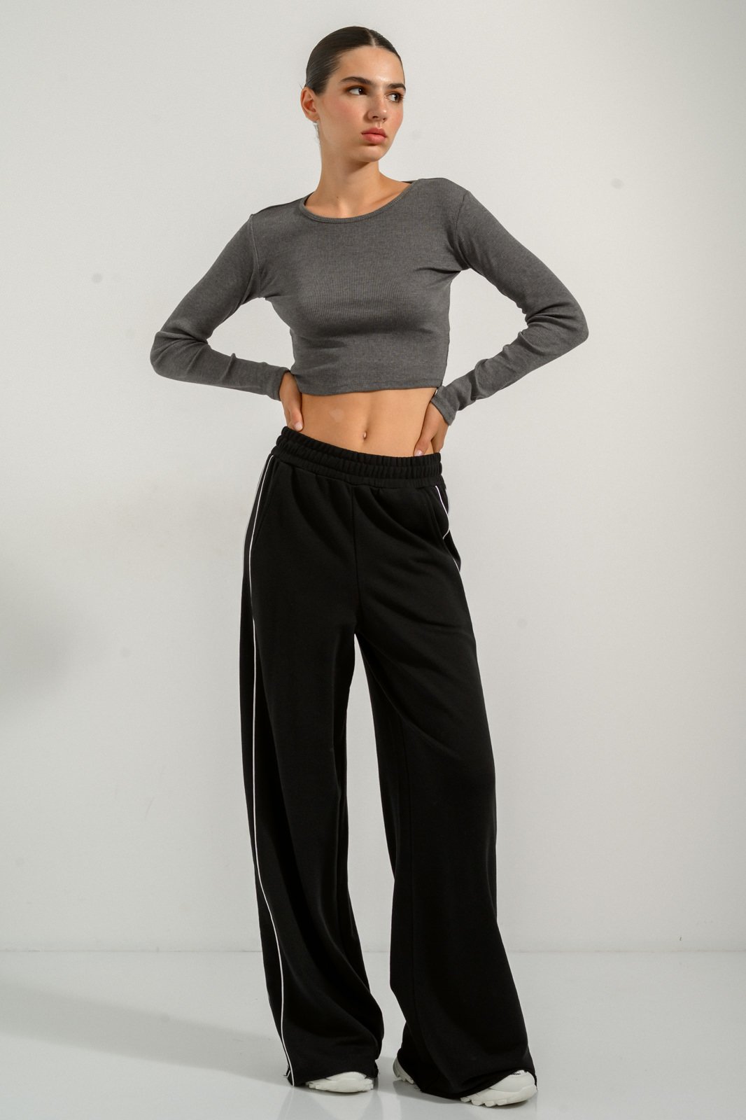 This crop top with high-waisted loose striped pants