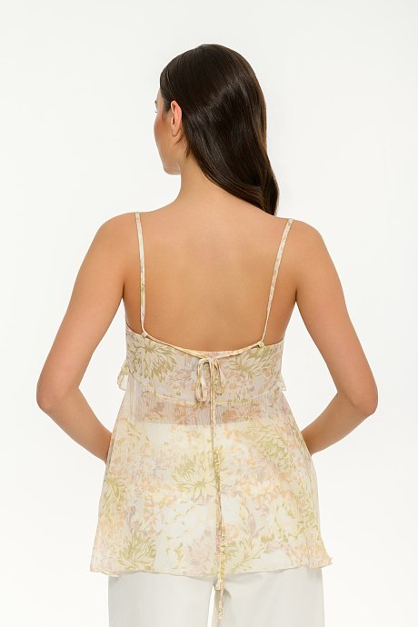 See through sleeveless floral top with ruffle details