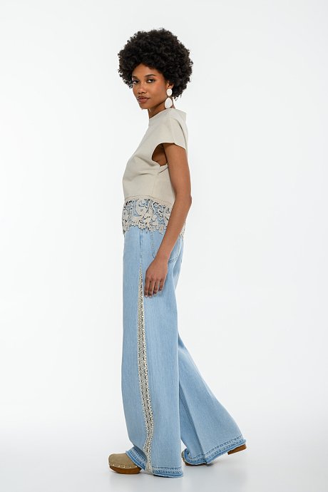 Blouse with embroidered cutwork detail on the hem