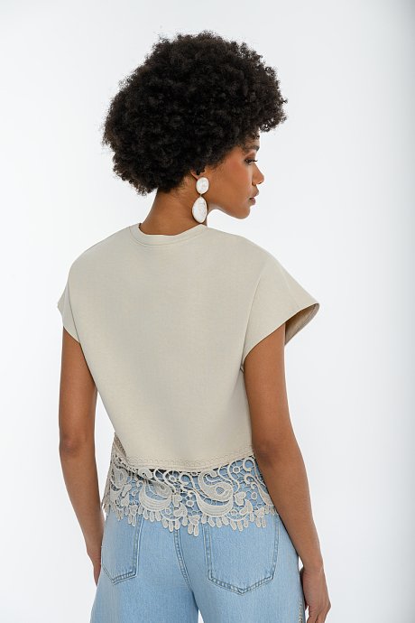 Blouse with embroidered cutwork detail on the hem