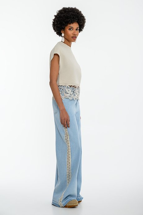 Blouse with embroidered cutwork detail on the hem
