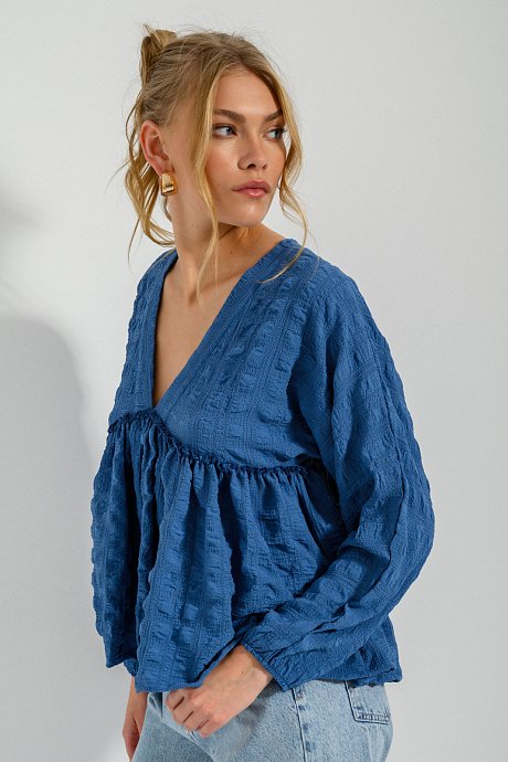 Blouse with ruffled details and V neckline