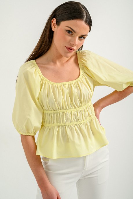 Ruffled top with gathering details