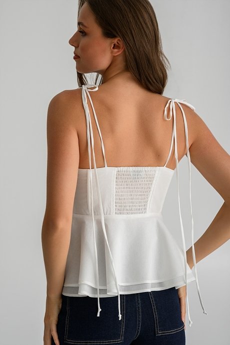 Top with thin straps tie and peplum hem