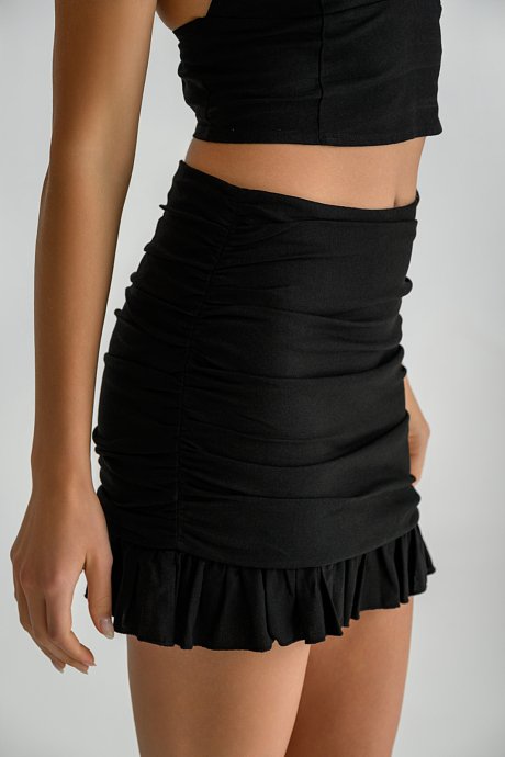 Mini linen skirt with shirring details and ruffles
