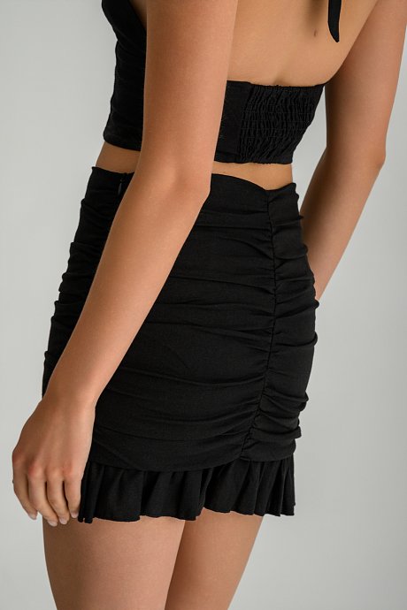 Mini linen skirt with shirring details and ruffles