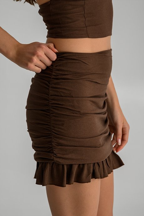 Mini linen skirt with shirring details and ruffles