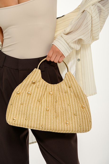 Clutch handbag with metal handle and studs