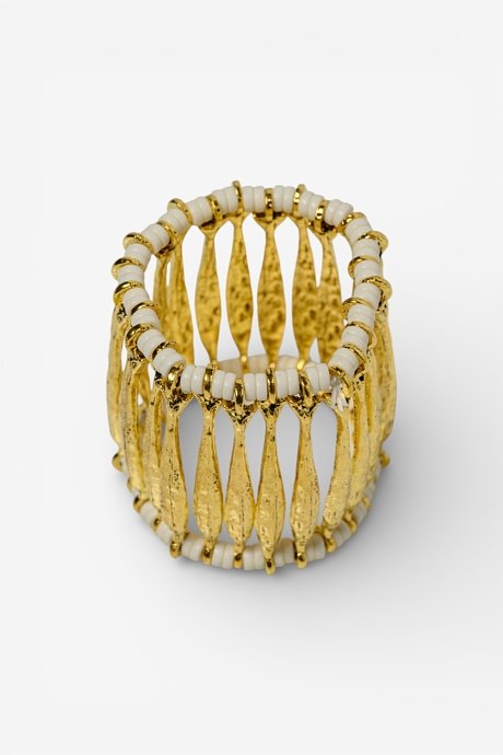 Elastic gold effect bracelet with decorative details