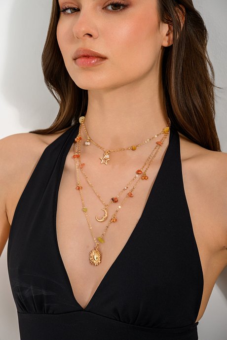 Set of gold tone chain necklaces with pendants