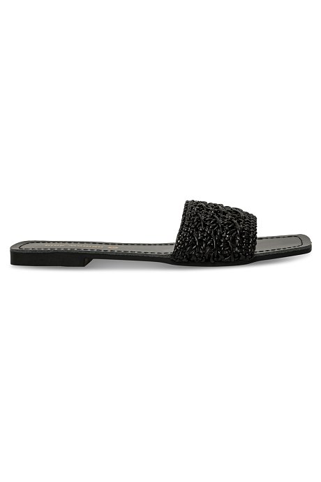 Flat sandals with woven band